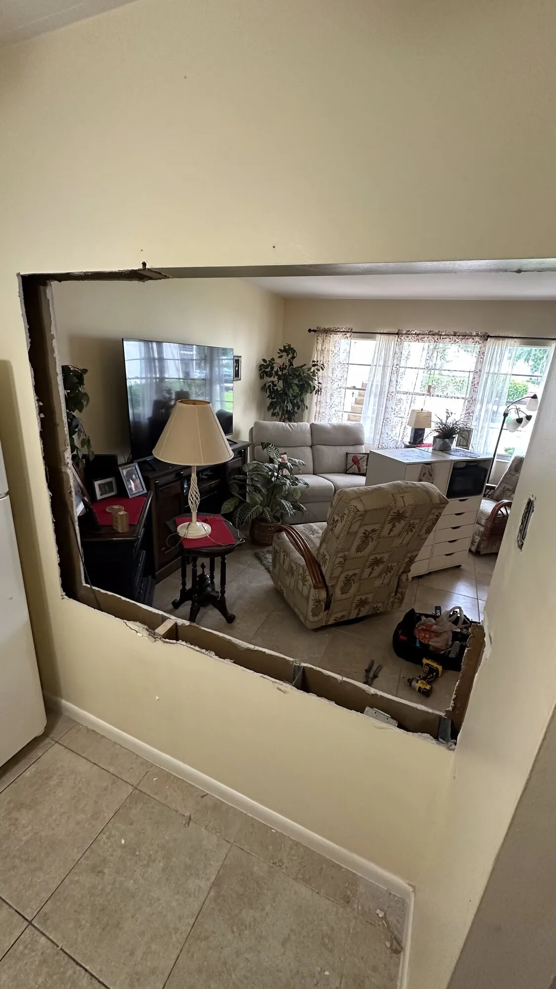Large framed mirror mounted level on a living room wall