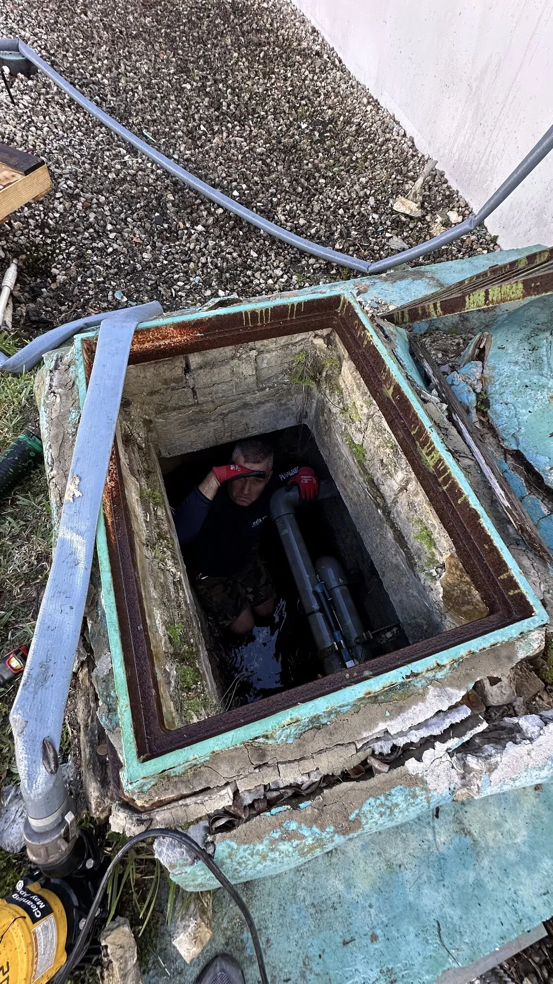 Exterior utility pit opened up for repair work