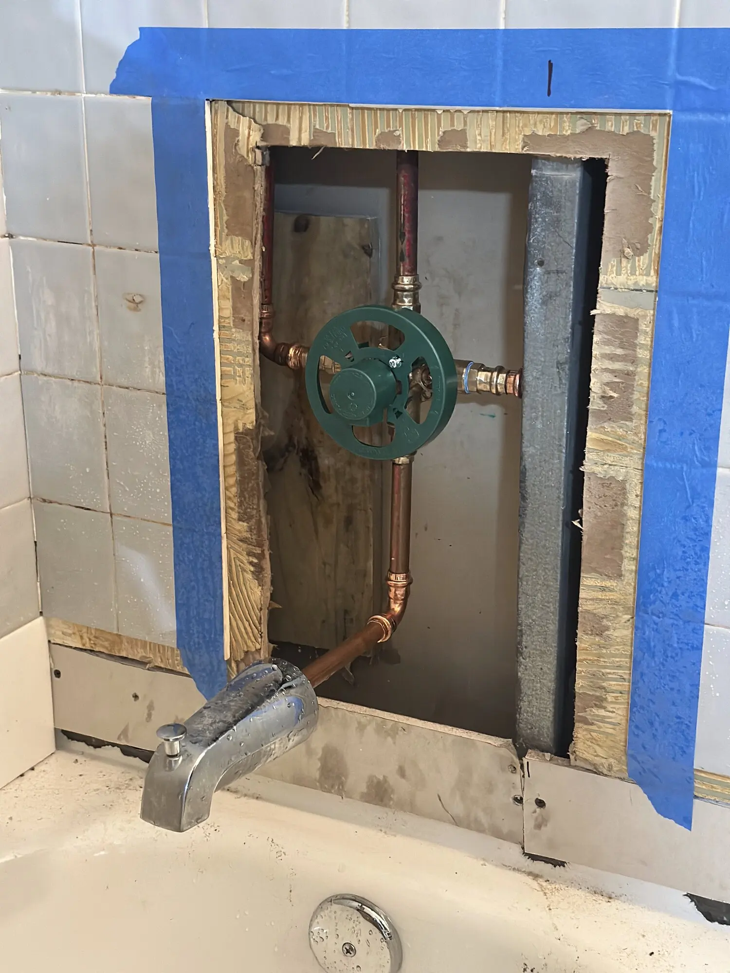 Shower valve and copper supply lines exposed during a fixture replacement