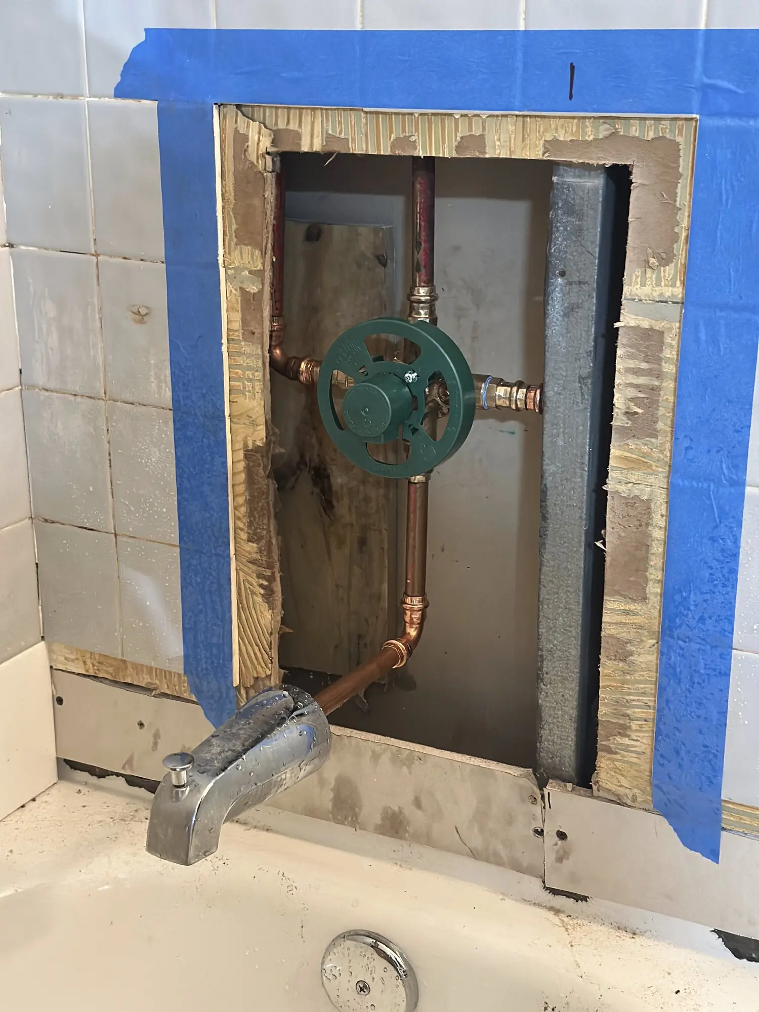 Shower valve and copper supply lines exposed during a fixture replacement